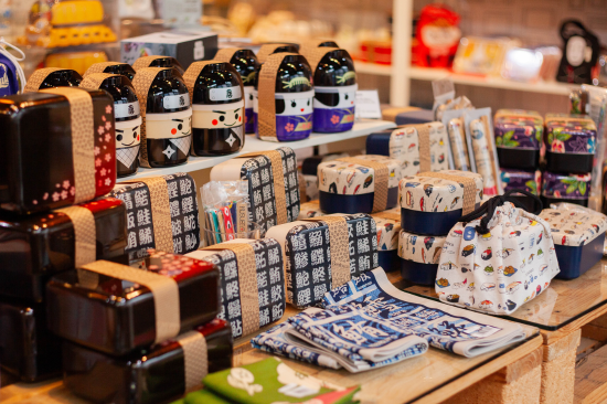 Bento Boxes of different shapes and patterns lined up in a store