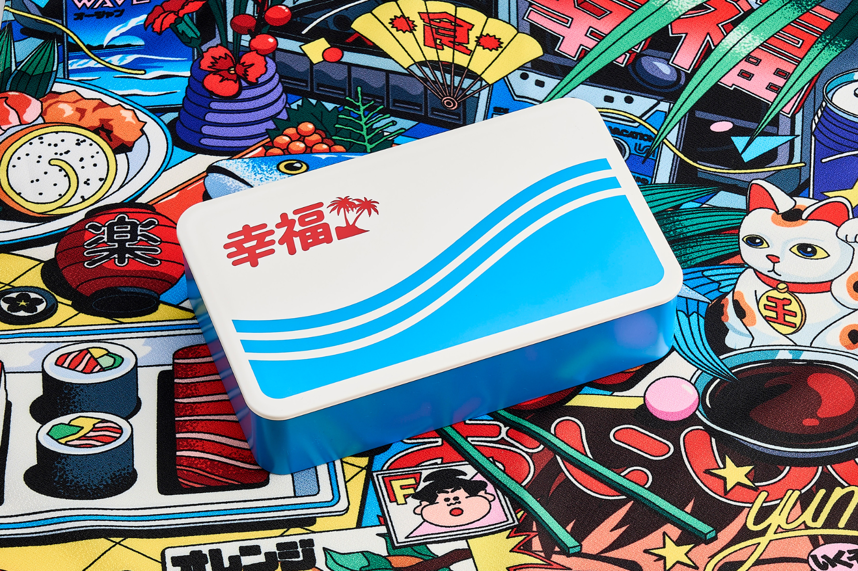Hand painted bento box inspired by 1980s Japanese pop culture on a retro-futuristic furoshiki wrapping cloth