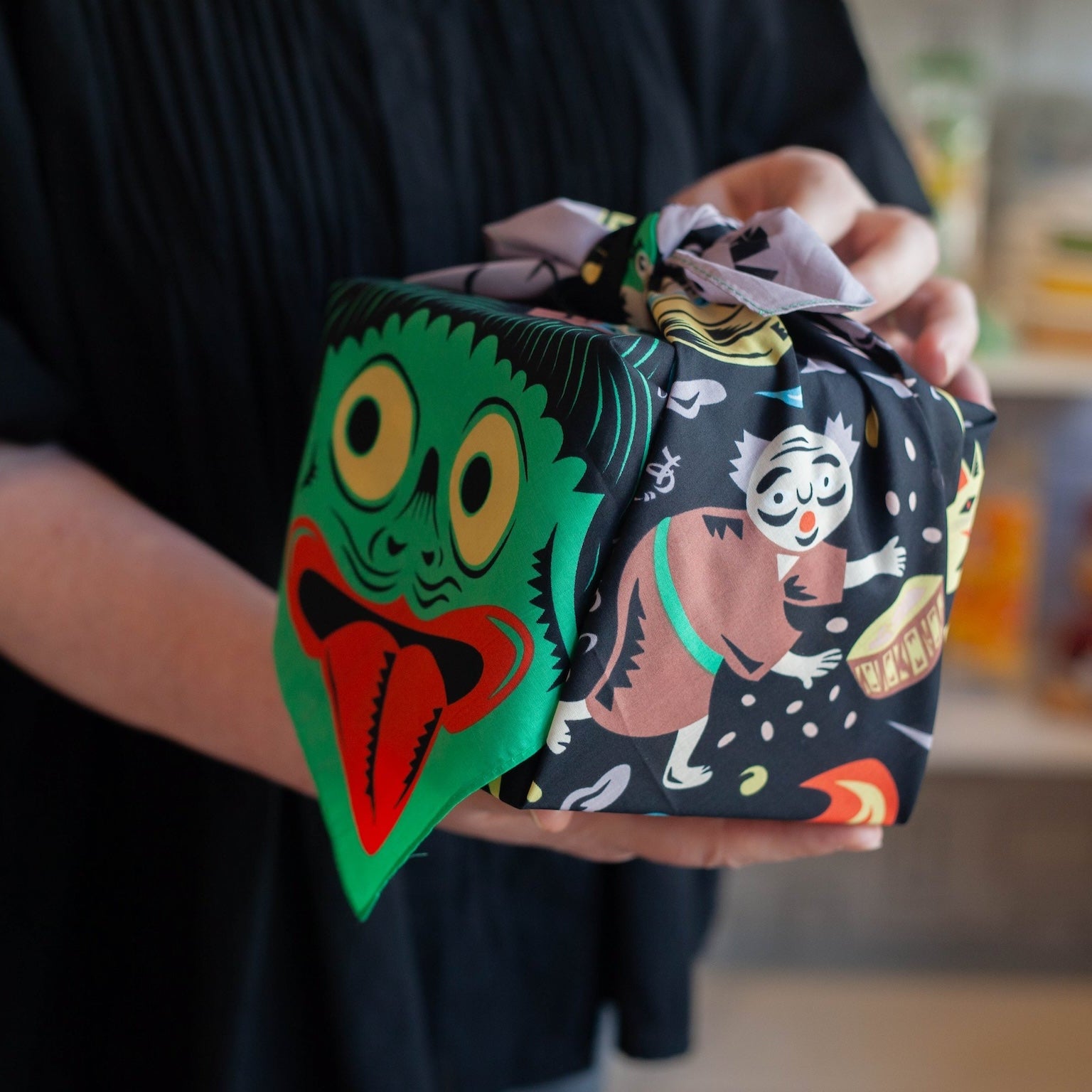 Cochae Musubi Furoshiki 70cm Yokai – Japanese wrapping cloth with colorful yokai spirits including kappa, oni and tsukumogami on black cotton fabric
