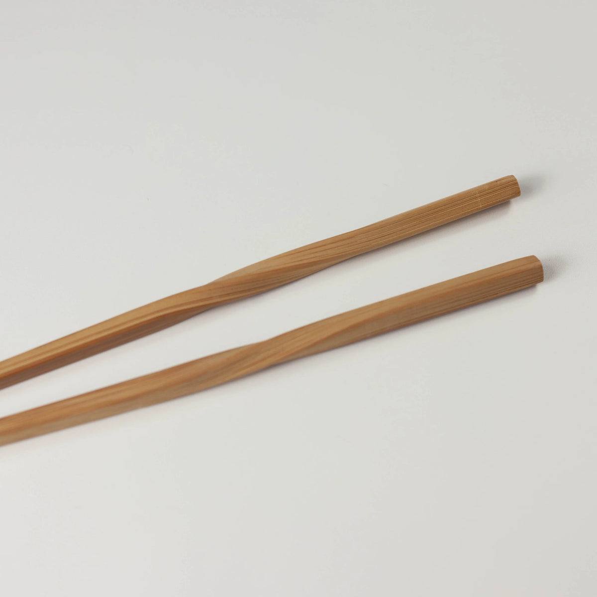 Close-up of the twisted bamboo chopstick handles and squared ends