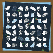 Blue and brown Japanese cotton furoshiki cloth featuring white rabbit silhouettes decorated with traditional komon geometric patterns