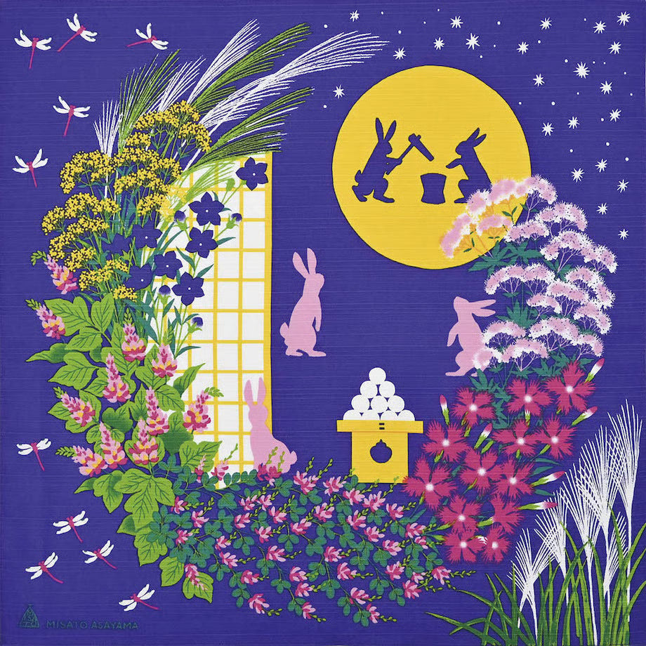 Japanese cotton furoshiki cloth designed by Misato Asayama with blue starry background, autumn floral wreath, and moon rabbits