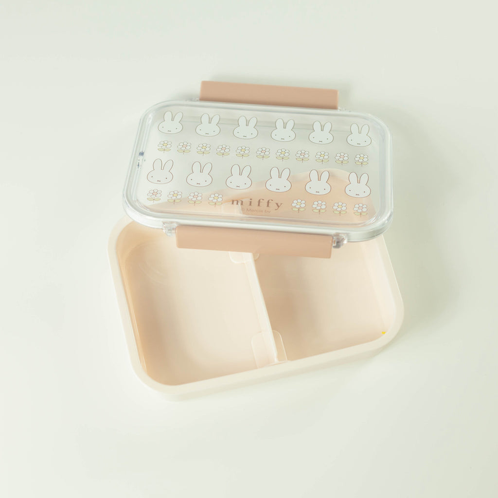 Rectangular lunch box with rabbit designs against a light background