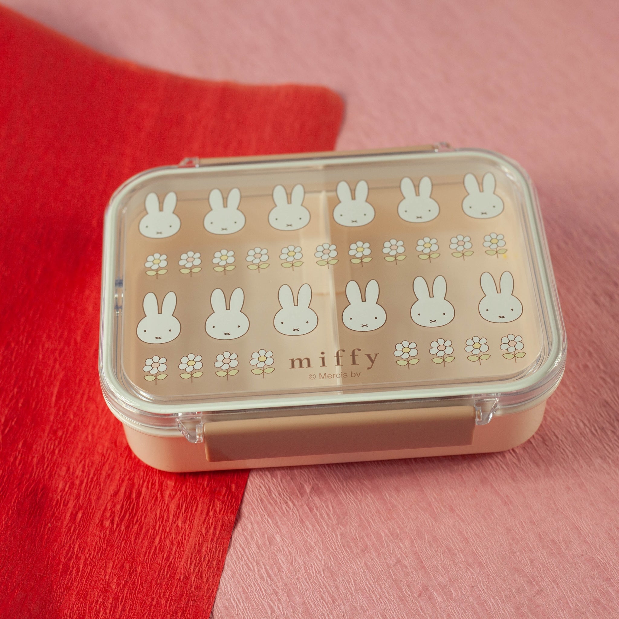 Rectangular container with bunny pattern on a red and pink background