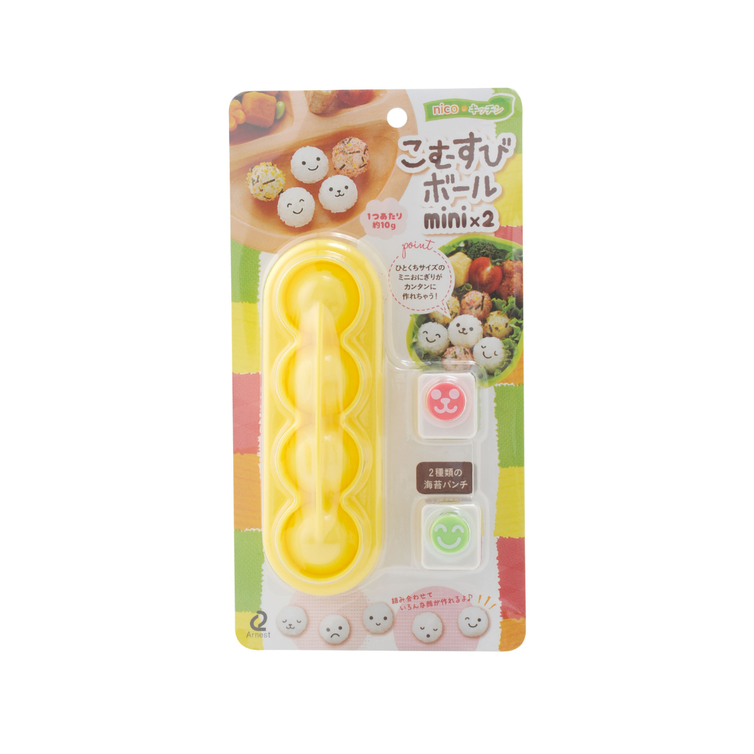 Arnest Baby Onigiri Rice Mold Set "Komusubi Ball Mini x2" retail packaging – yellow mold and two nori punches on a colorful Japanese card with product photos, on white background
