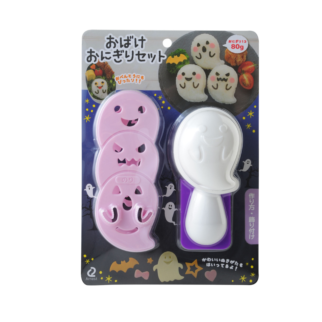 Arnest Ghost Onigiri Set retail packaging – three pink ghost-face nori punches and a white ghost-shaped rice mold with handle on a dark Halloween-themed Japanese card showing example ghost onigiri, on white background