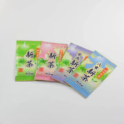 Four bags of seasonal Japanese Shincha green tea from Shizuoka, Kagoshima, Uji, and Yame on a white background