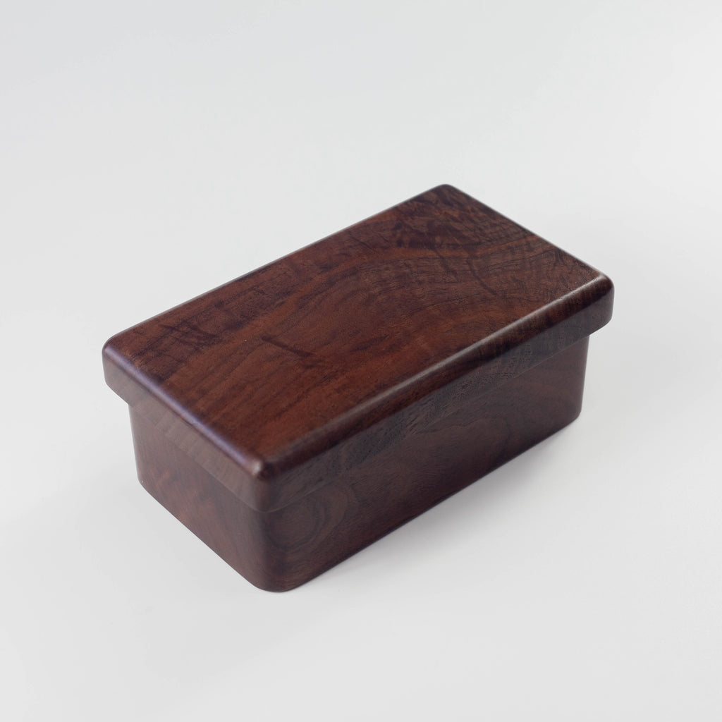 Wooden box with a dark brown finish on a light gray background